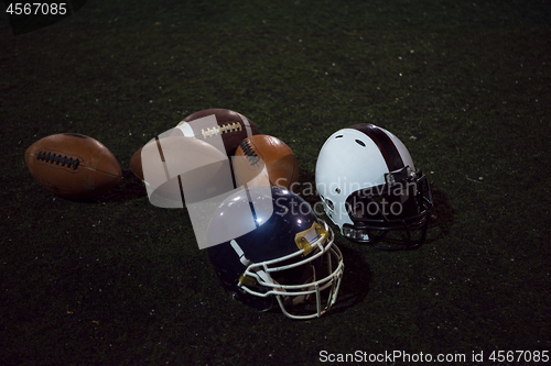 Image of american football and helmets