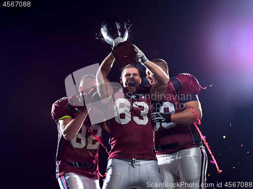 Image of american football team celebrating victory