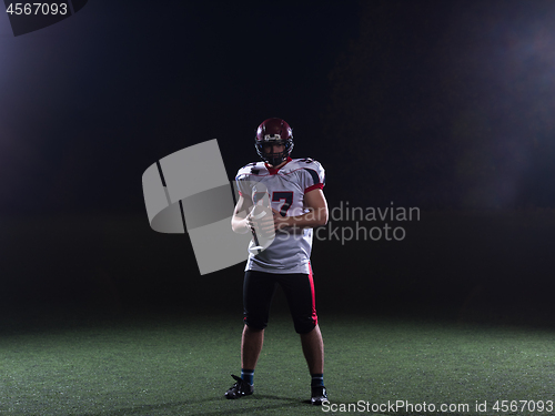 Image of portrait of confident American football player