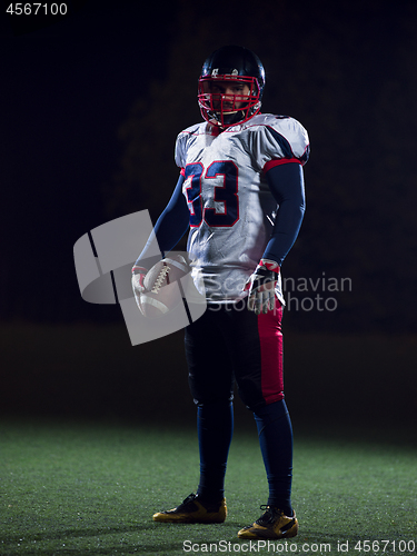 Image of portrait of confident American football player