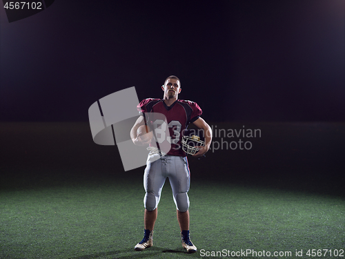 Image of portrait of young confident American football player