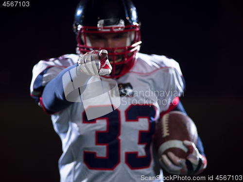 Image of portrait of confident American football player