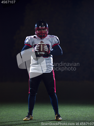 Image of portrait of confident American football player