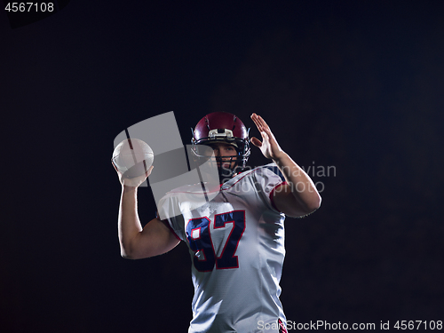 Image of american football player throwing rugby ball