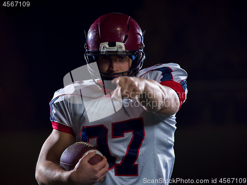 Image of portrait of confident American football player