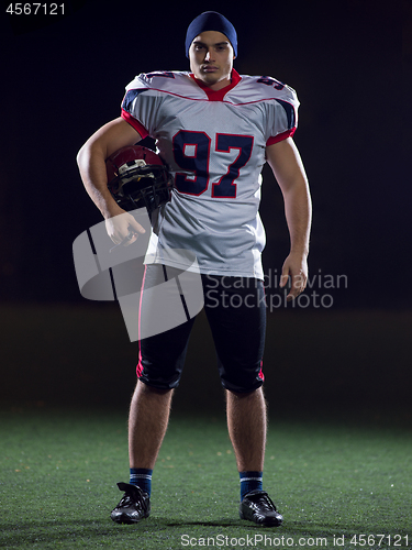 Image of portrait of young confident American football player