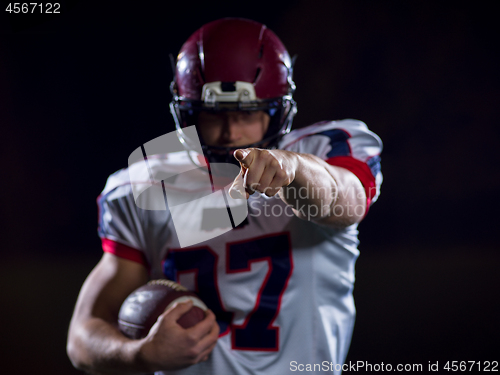 Image of portrait of confident American football player