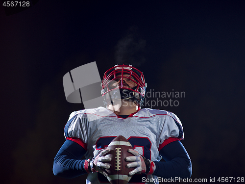 Image of portrait of confident American football player