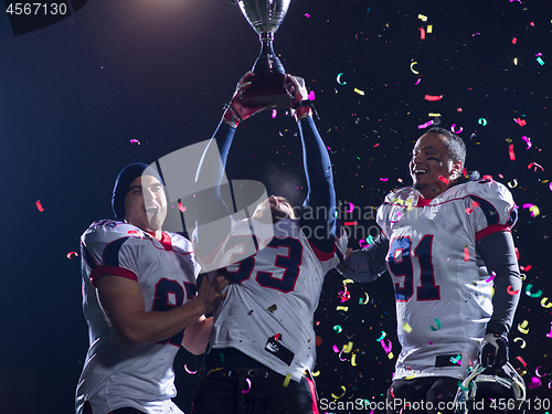 Image of american football team celebrating victory