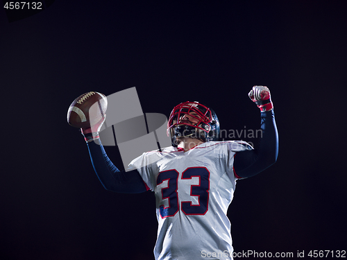 Image of american football player celebrating after scoring a touchdown