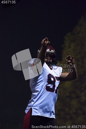 Image of american football player throwing rugby ball