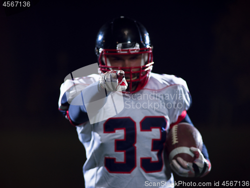 Image of portrait of confident American football player