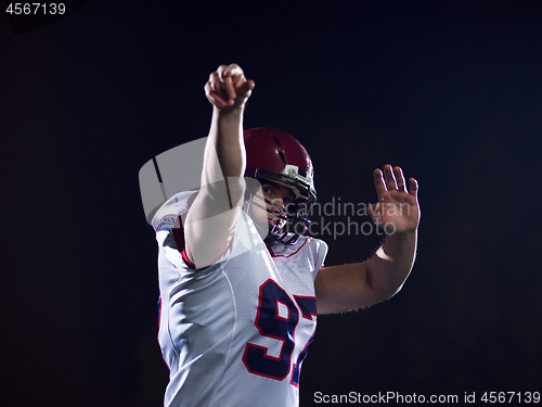 Image of american football player throwing rugby ball