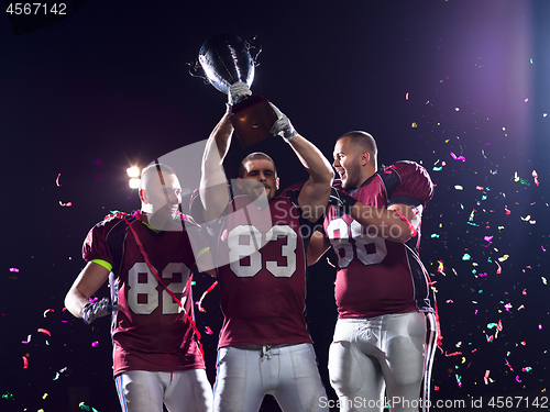 Image of american football team celebrating victory