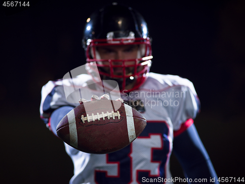 Image of portrait of confident American football player