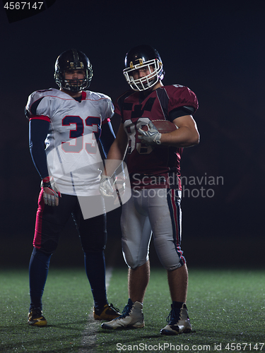 Image of portrait of confident American football players