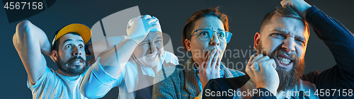 Image of The emotional angry men screaming on blue studio background