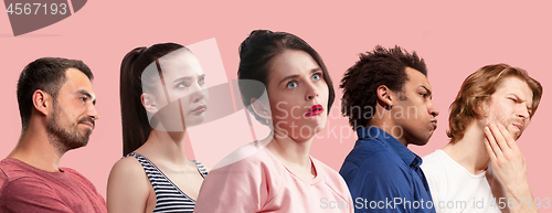 Image of Beautiful bored people bored isolated on pink background