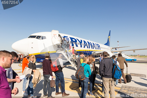 Image of Trieste airport, Italy - 20 April 2018: People boarding Ryanair plane on Friuli Venezia Giulia Airport in Trieste, italy on April 20th, 2018. Ryanair is the biggest low-cost airline company in Europe