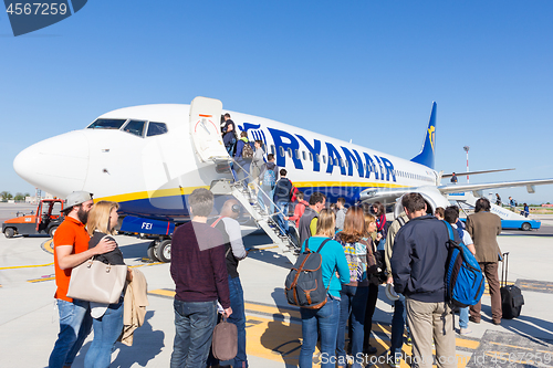 Image of Trieste airport, Italy - 20 April 2018: People boarding Ryanair plane on Friuli Venezia Giulia Airport in Trieste, italy on April 20th, 2018. Ryanair is the biggest low-cost airline company in Europe