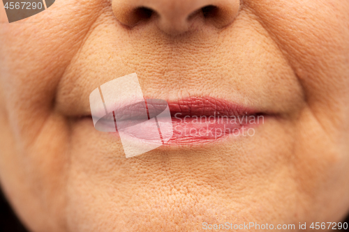 Image of close up of senior woman lips