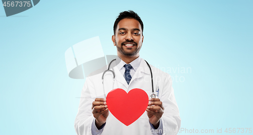 Image of smiling indian male doctor with red heart shape