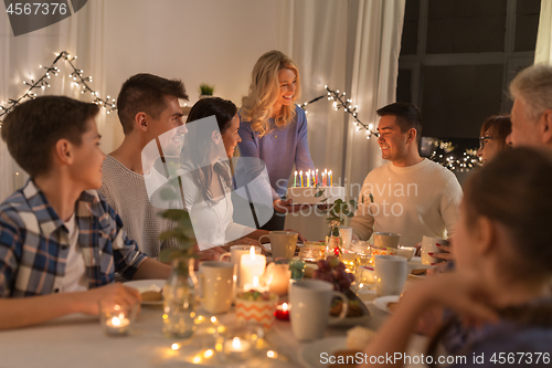 Image of happy family having birthday party at home