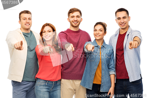 Image of group of smiling friends pointing at you over