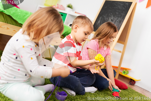 Image of children with modelling clay or slimes at home