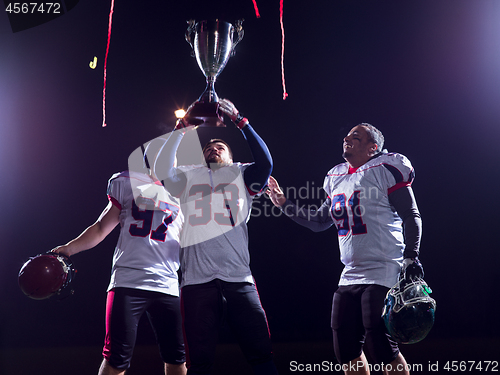 Image of american football team celebrating victory