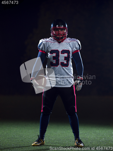 Image of portrait of confident American football player