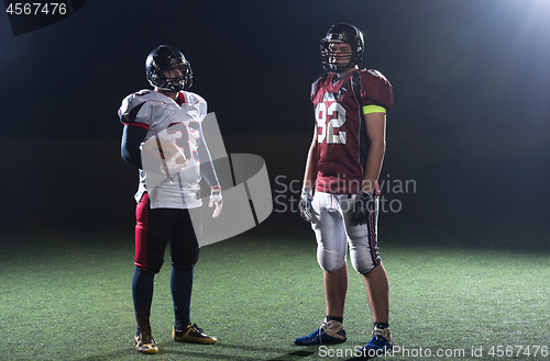 Image of portrait of confident American football players