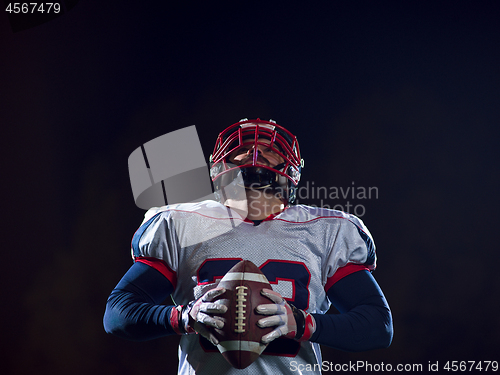 Image of portrait of confident American football player