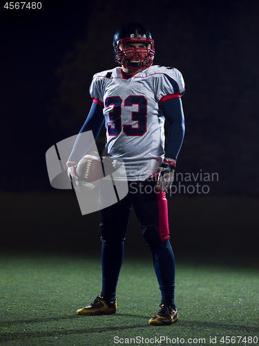 Image of portrait of confident American football player