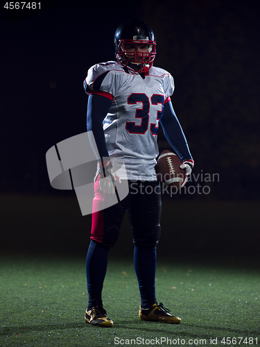 Image of portrait of confident American football player