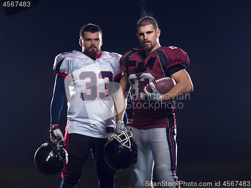 Image of portrait of confident American football players