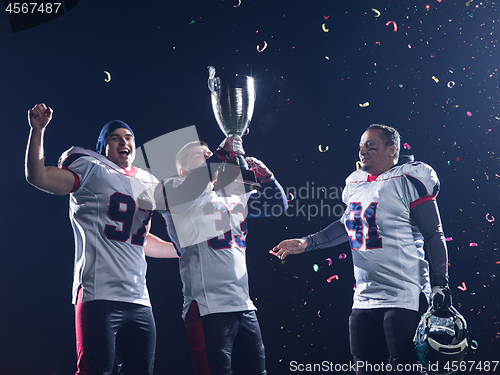 Image of american football team celebrating victory