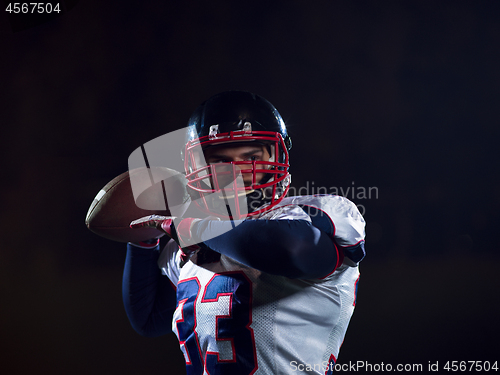 Image of american football player throwing rugby ball