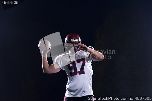 Image of american football player throwing rugby ball