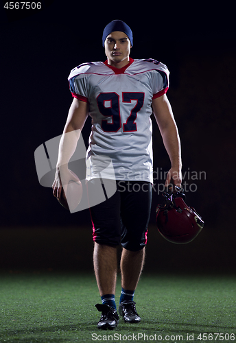 Image of portrait of young confident American football player