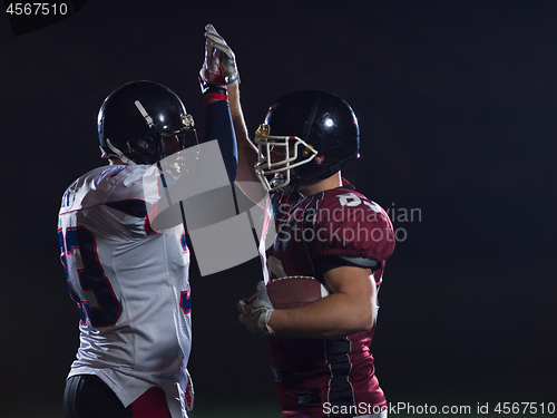 Image of american football players celebrating after scoring a touchdown