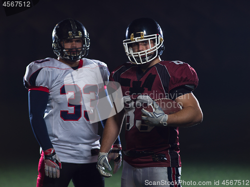 Image of portrait of confident American football players