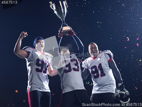 Image of american football team celebrating victory