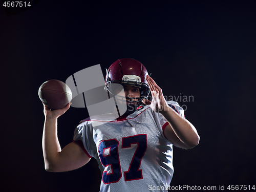 Image of american football player throwing rugby ball