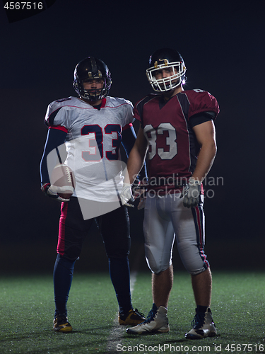 Image of portrait of confident American football players