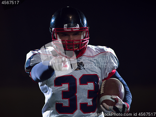 Image of portrait of confident American football player