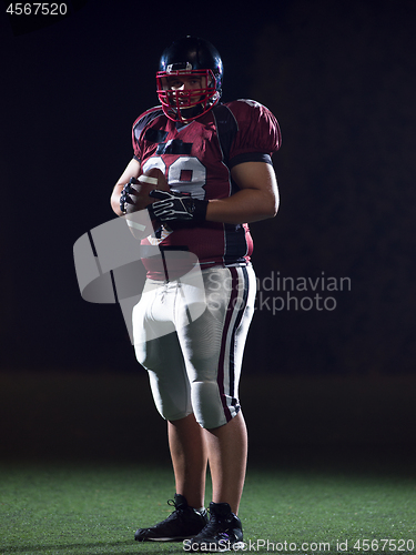 Image of portrait of confident American football player