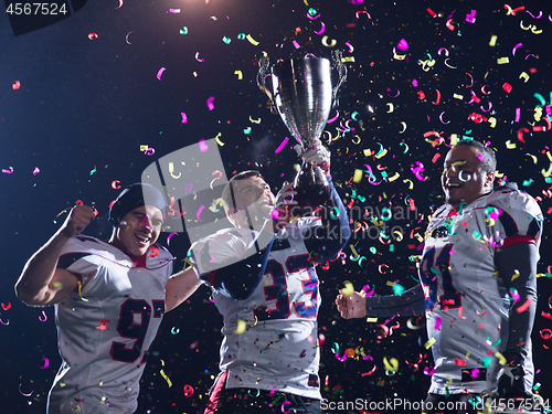 Image of american football team celebrating victory