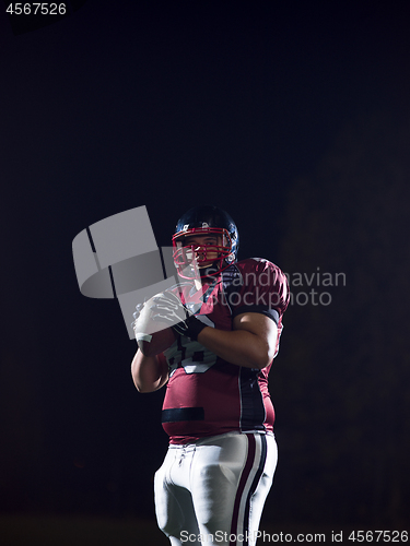 Image of portrait of confident American football player