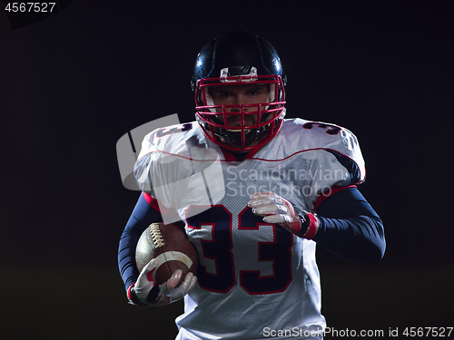 Image of portrait of confident American football player